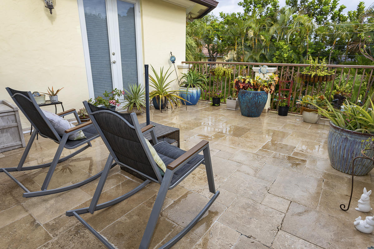 1301 Southwest 16th Street Boca Raton, FL 33486 - Photo 36 of 57 a view of a chairs and table in the patio