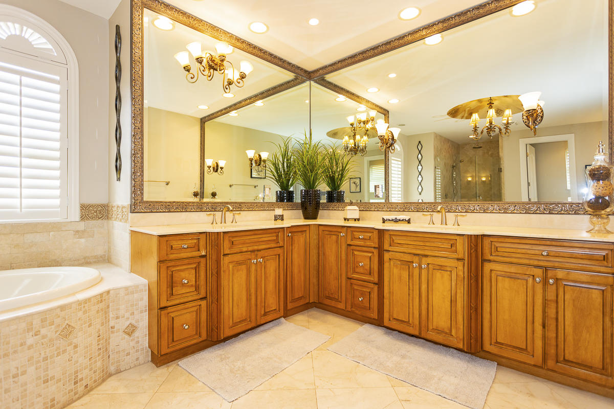 1301 Southwest 16th Street Boca Raton, FL 33486 - Photo 39 of 57 a spacious bathroom with a sink a vanity a mirror a bathtub and next to a window