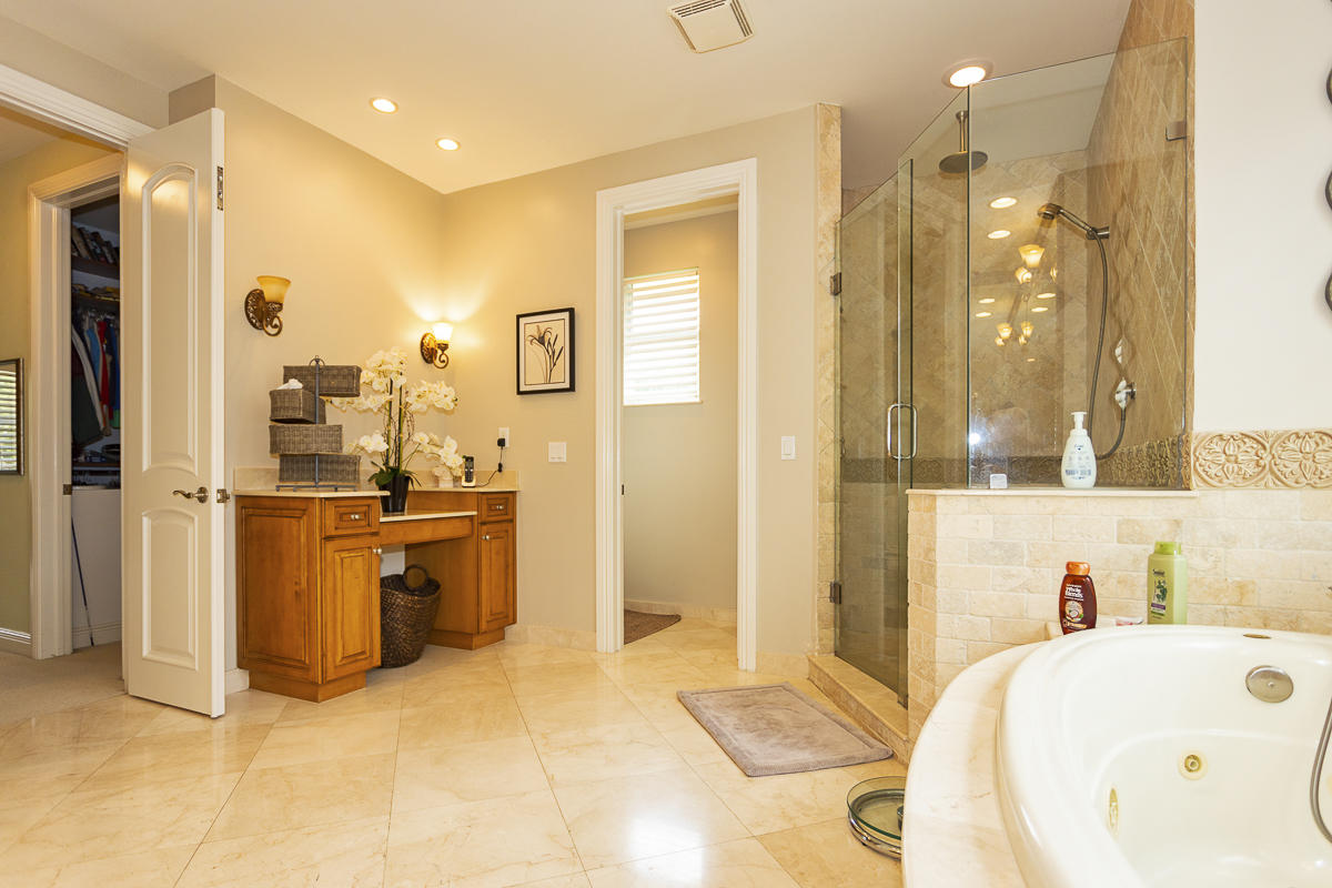 1301 Southwest 16th Street Boca Raton, FL 33486 - Photo 40 of 57 a bathroom with a tub sink and mirror