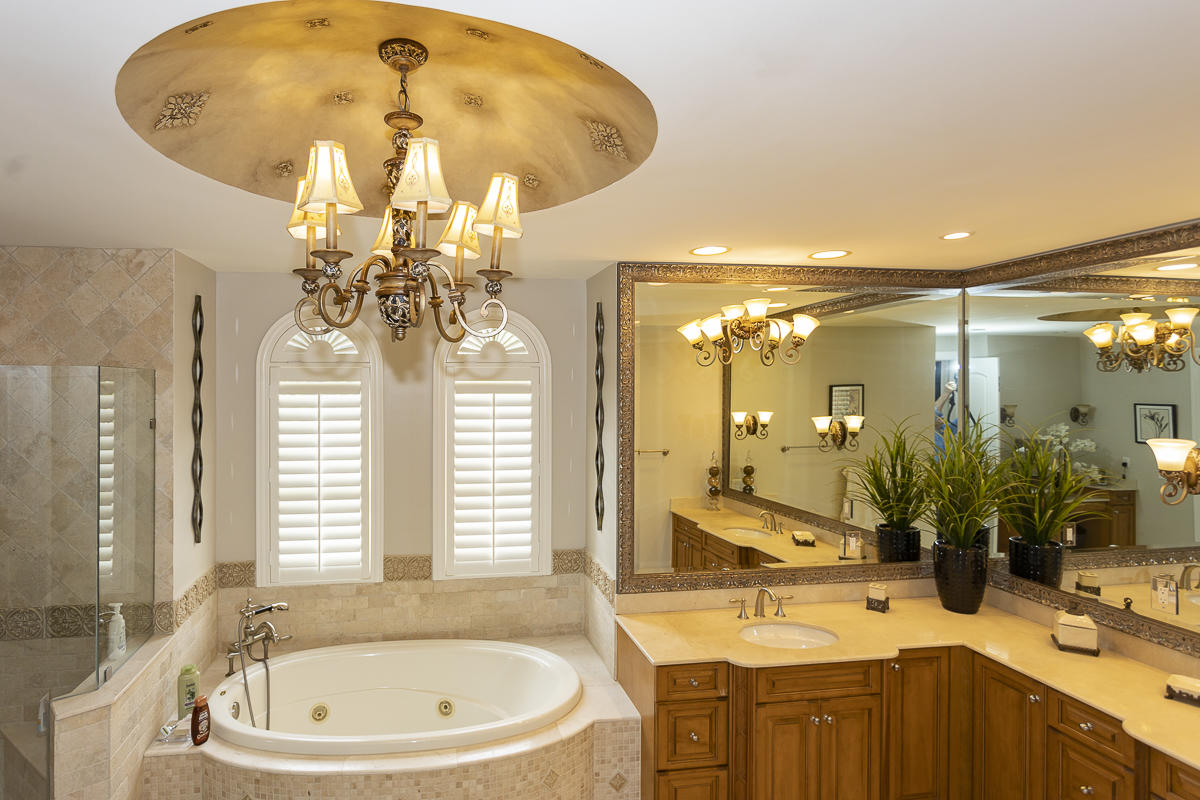 1301 Southwest 16th Street Boca Raton, FL 33486 - Photo 41 of 57 a bathroom with a sink double vanity mirror and a bathtub