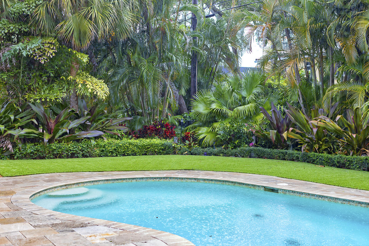 1301 Southwest 16th Street Boca Raton, FL 33486 - Photo 43 of 57 a view of a garden with a bench in the background