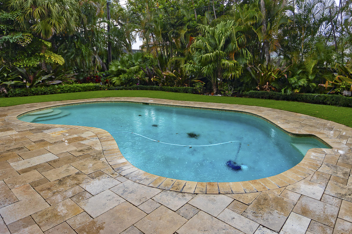 1301 Southwest 16th Street Boca Raton, FL 33486 - Photo 44 of 57 a view of a swimming pool with a yard