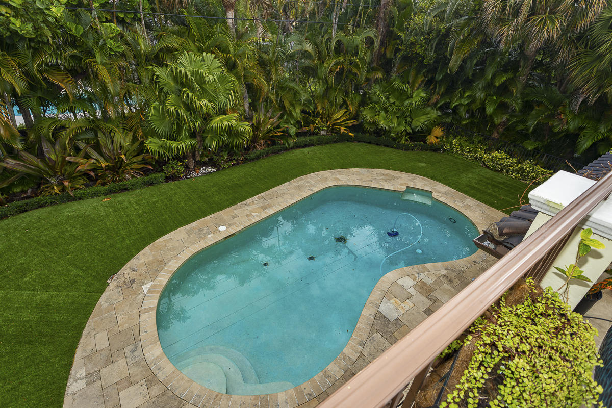 1301 Southwest 16th Street Boca Raton, FL 33486 - Photo 45 of 57 a view of a swimming pool with a sitting space