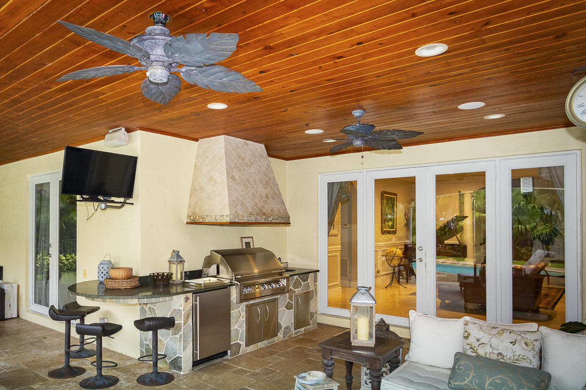 1301 Southwest 16th Street Boca Raton, FL 33486 - Photo 46 of 57 a room with furniture and a flat screen tv