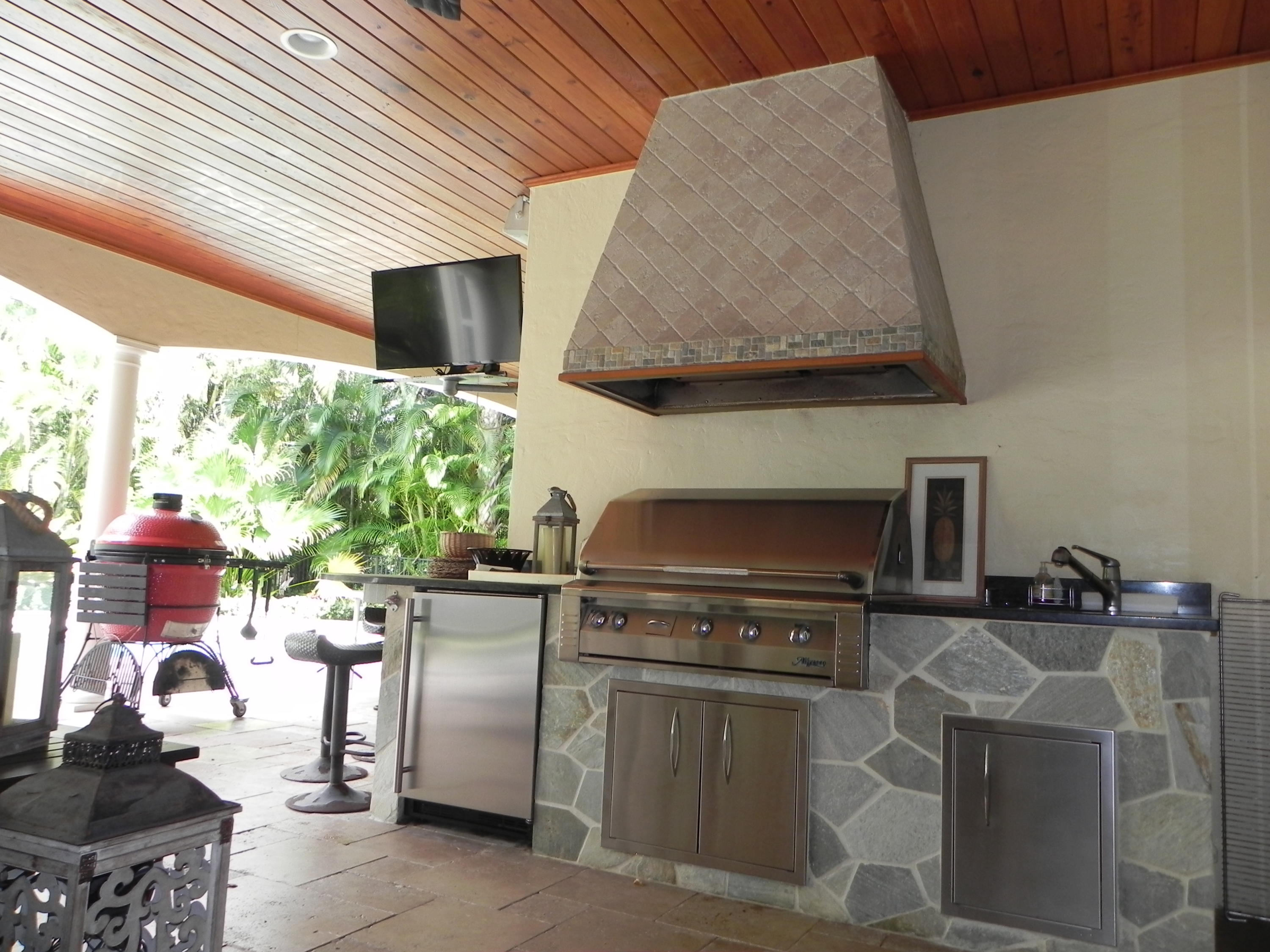 1301 Southwest 16th Street Boca Raton, FL 33486 - Photo 48 of 57 a kitchen with stainless steel appliances a stove a sink and a microwave
