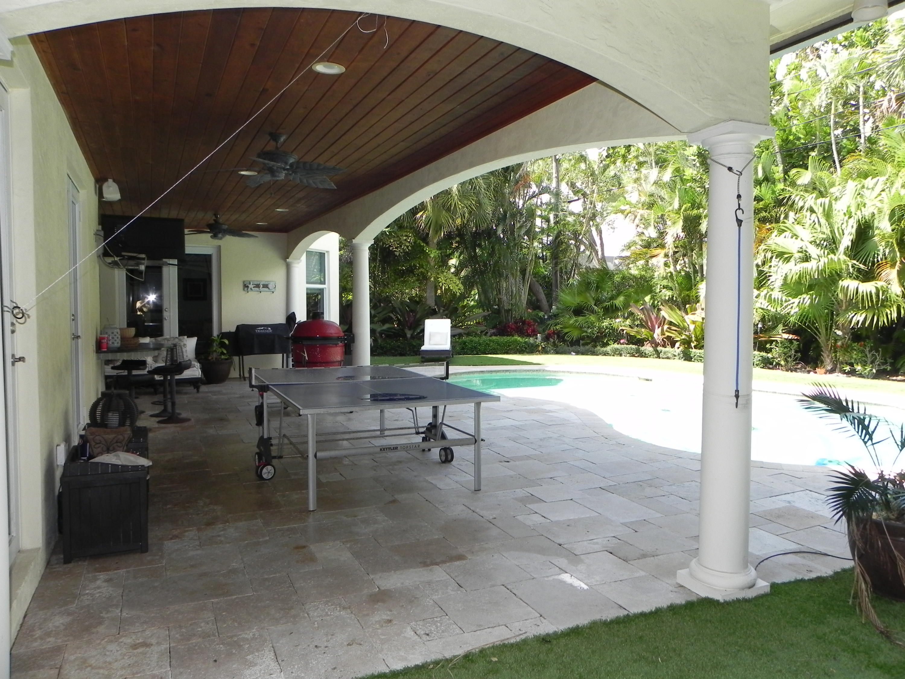 1301 Southwest 16th Street Boca Raton, FL 33486 - Photo 49 of 57 a view of a porch with chairs and backyard