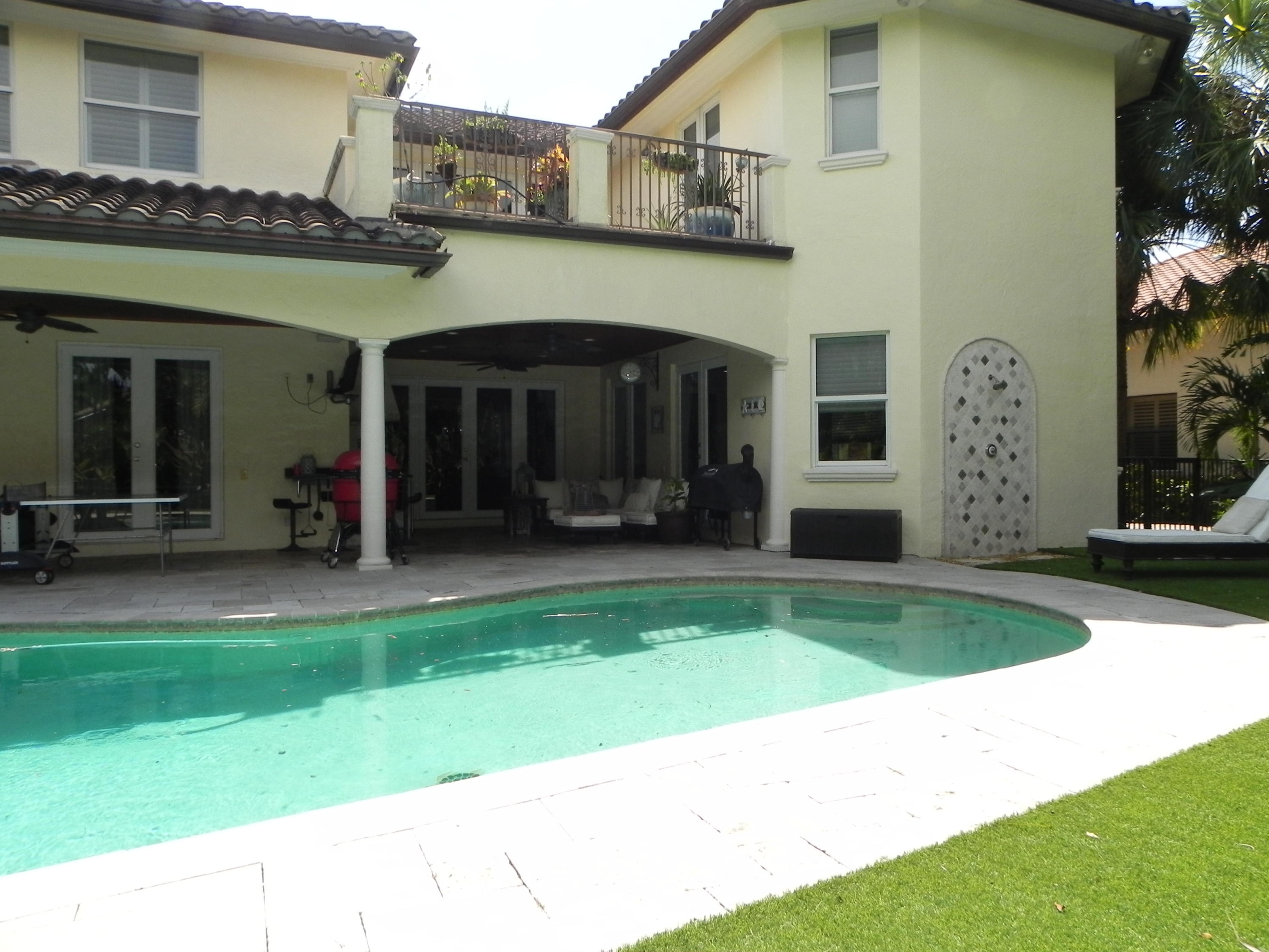 1301 Southwest 16th Street Boca Raton, FL 33486 - Photo 53 of 57 a view of a house with a swimming pool