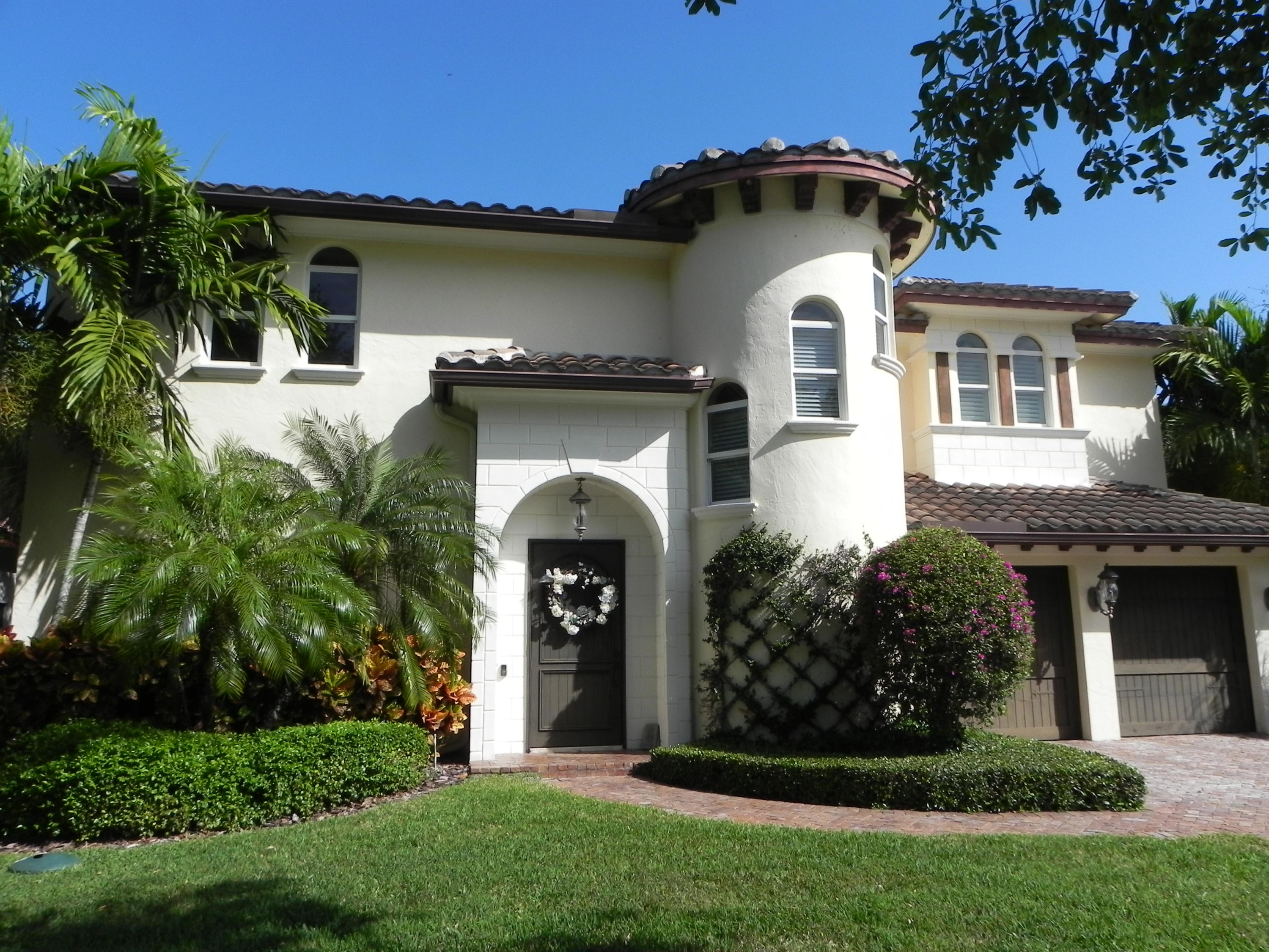 1301 Southwest 16th Street Boca Raton, FL 33486 - Photo 57 of 57 a front view of a house with garden