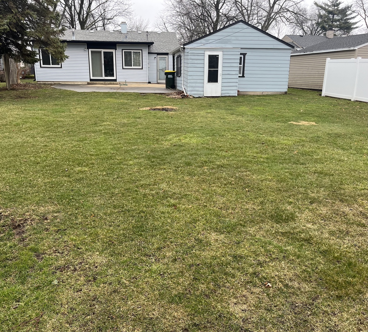 2601 George Street Rolling Meadows, IL 60008 - Photo 11 of 12 a white house that has a tree in front of it