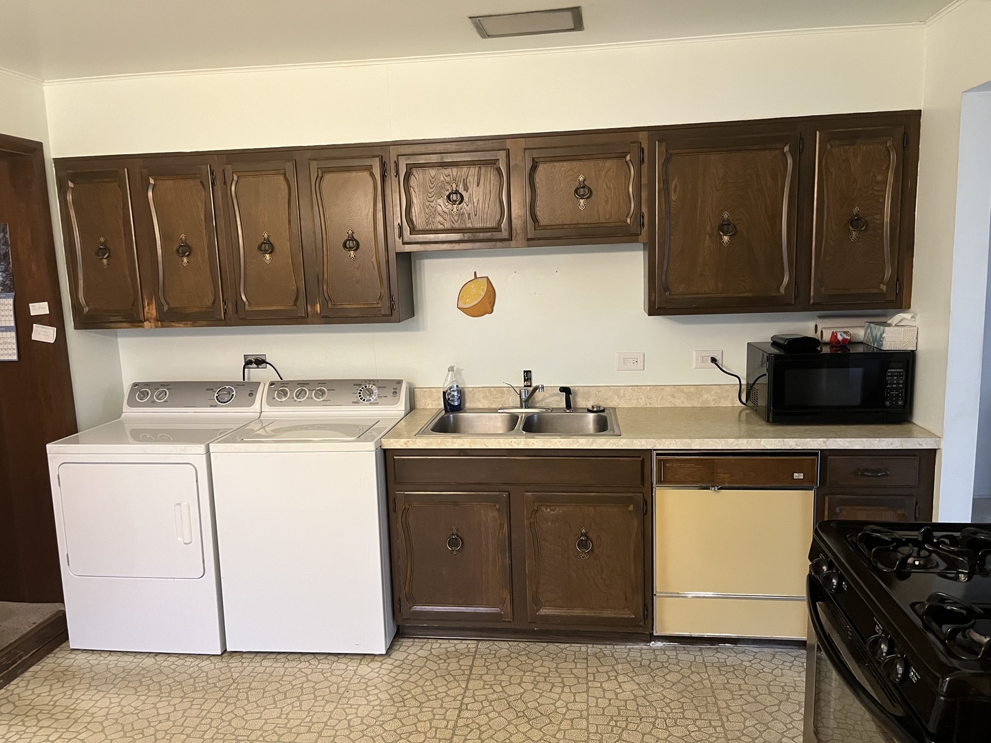 2601 George Street Rolling Meadows, IL 60008 - Photo 3 of 12 a kitchen with a sink and cabinets