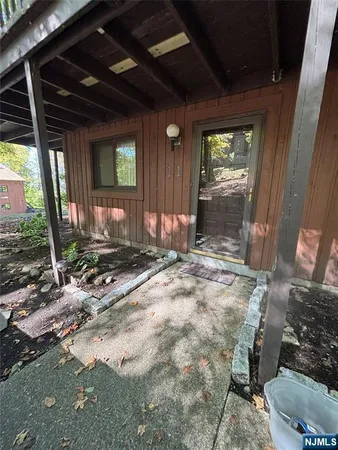 a view of a porch with wooden floor