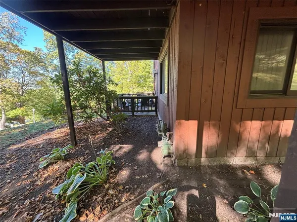 a backyard of a house with outdoor seating