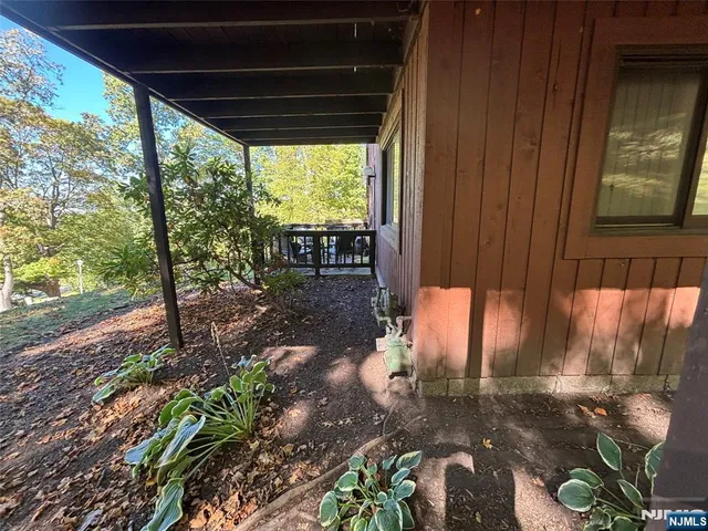 a backyard of a house with outdoor seating