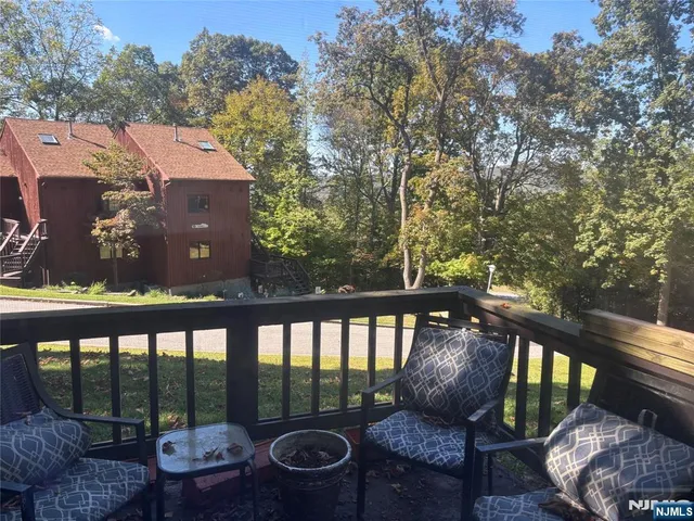 a view of balcony with furniture and outdoor seating