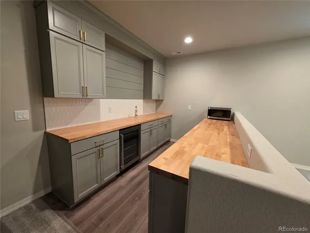 a kitchen with granite countertop cabinets and sink