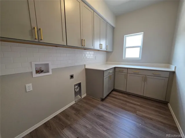 a kitchen with wooden cabinets and sink