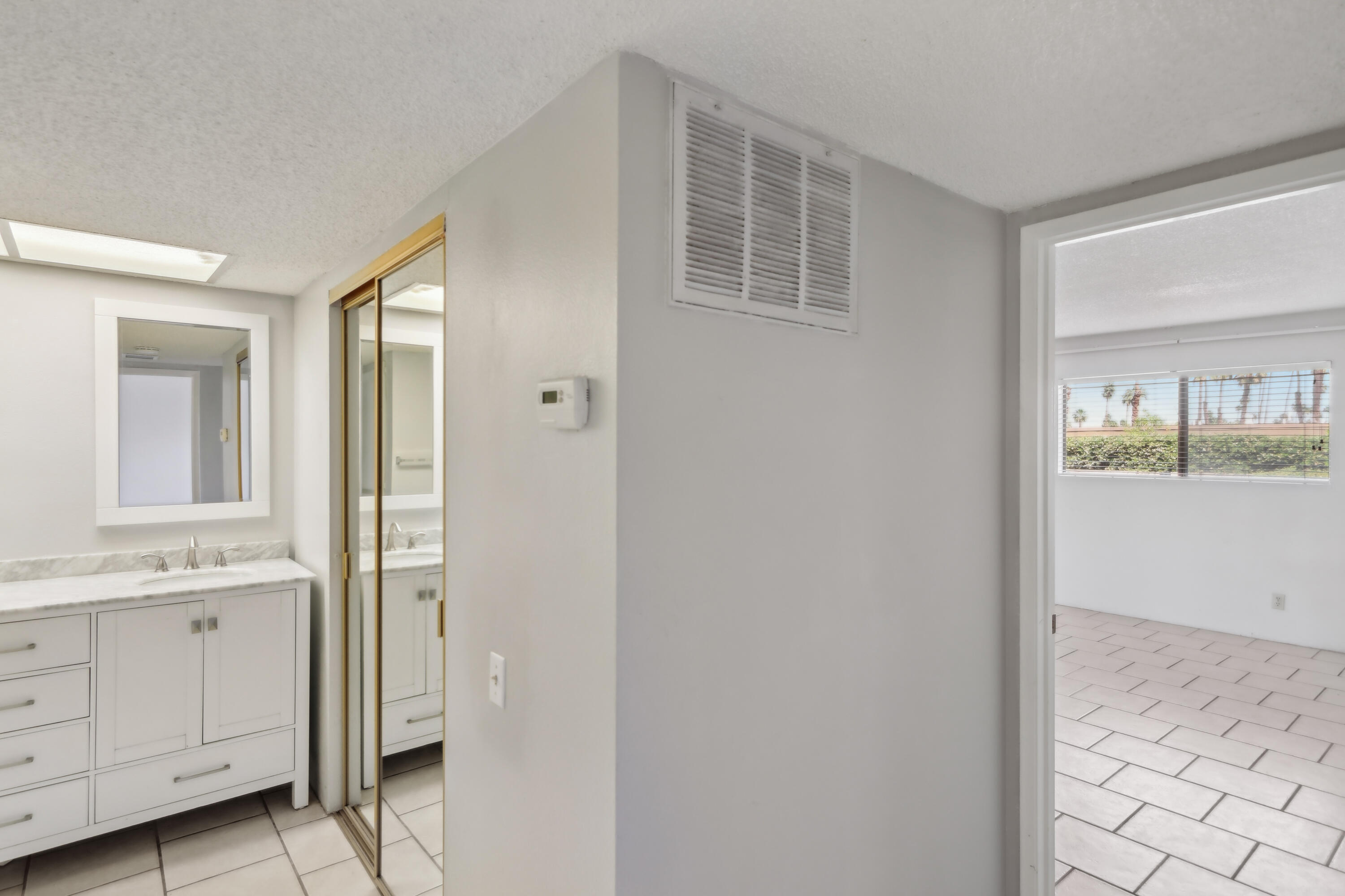 340 East San Jose Road, Unit 99 Palm Springs, CA 92264 - Photo 12 of 26 a view of cabinets with wooden floor