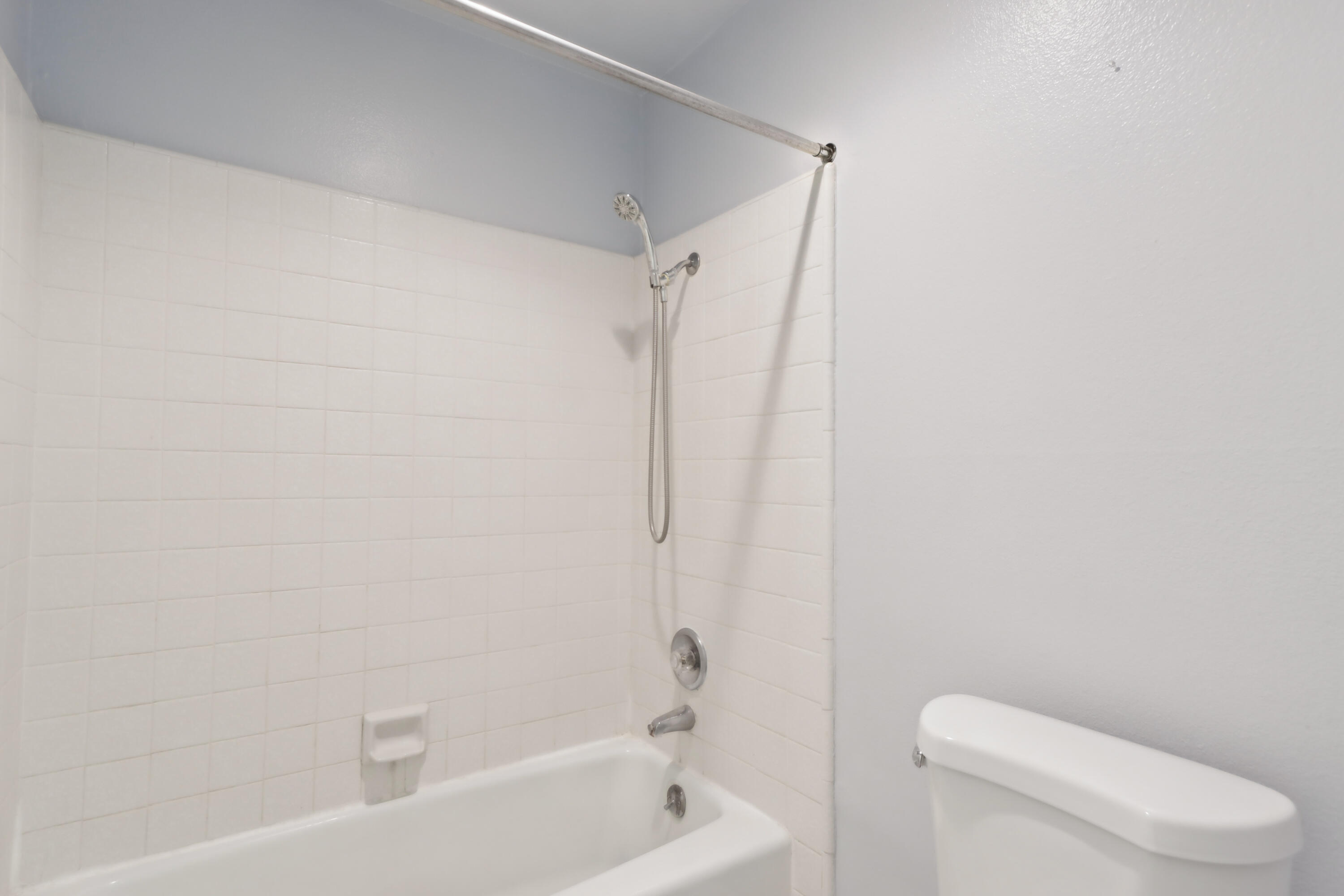 340 East San Jose Road, Unit 99 Palm Springs, CA 92264 - Photo 14 of 26 a white toilet sitting next to a bath tub