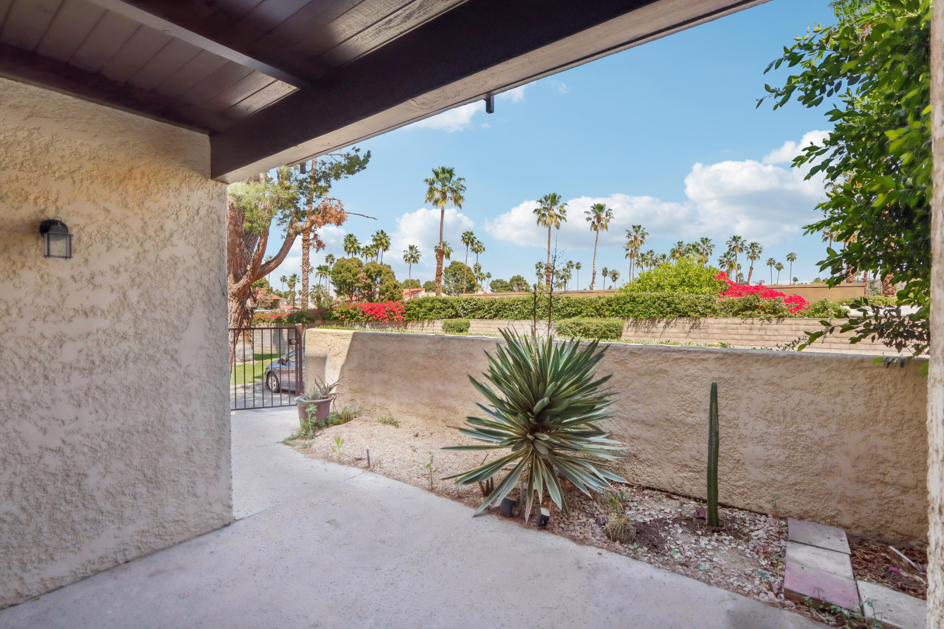 340 East San Jose Road, Unit 99 Palm Springs, CA 92264 - Photo 18 of 26 a view of a balcony with potted plants