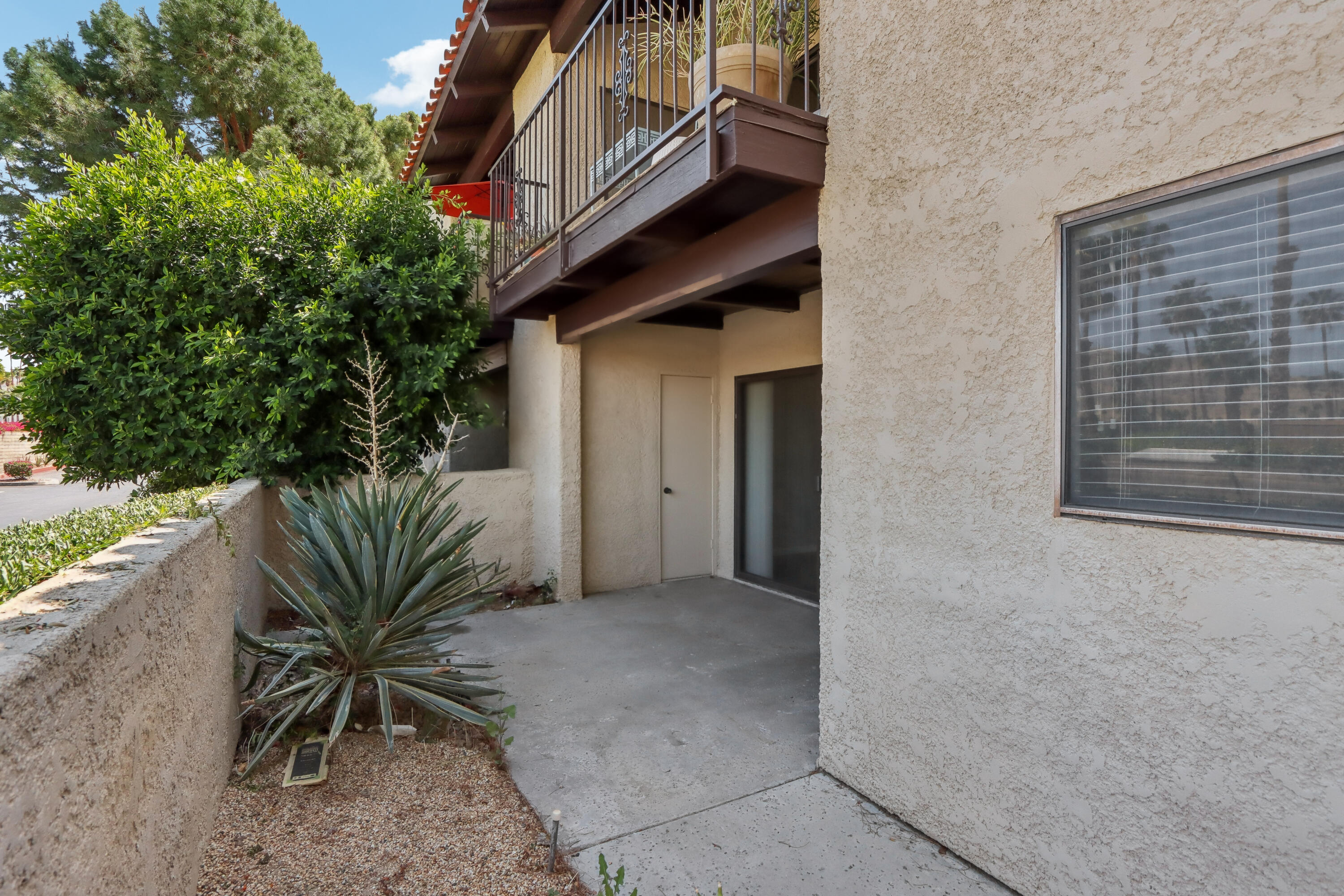 340 East San Jose Road, Unit 99 Palm Springs, CA 92264 - Photo 19 of 26 a view of a house with a small yard and plants