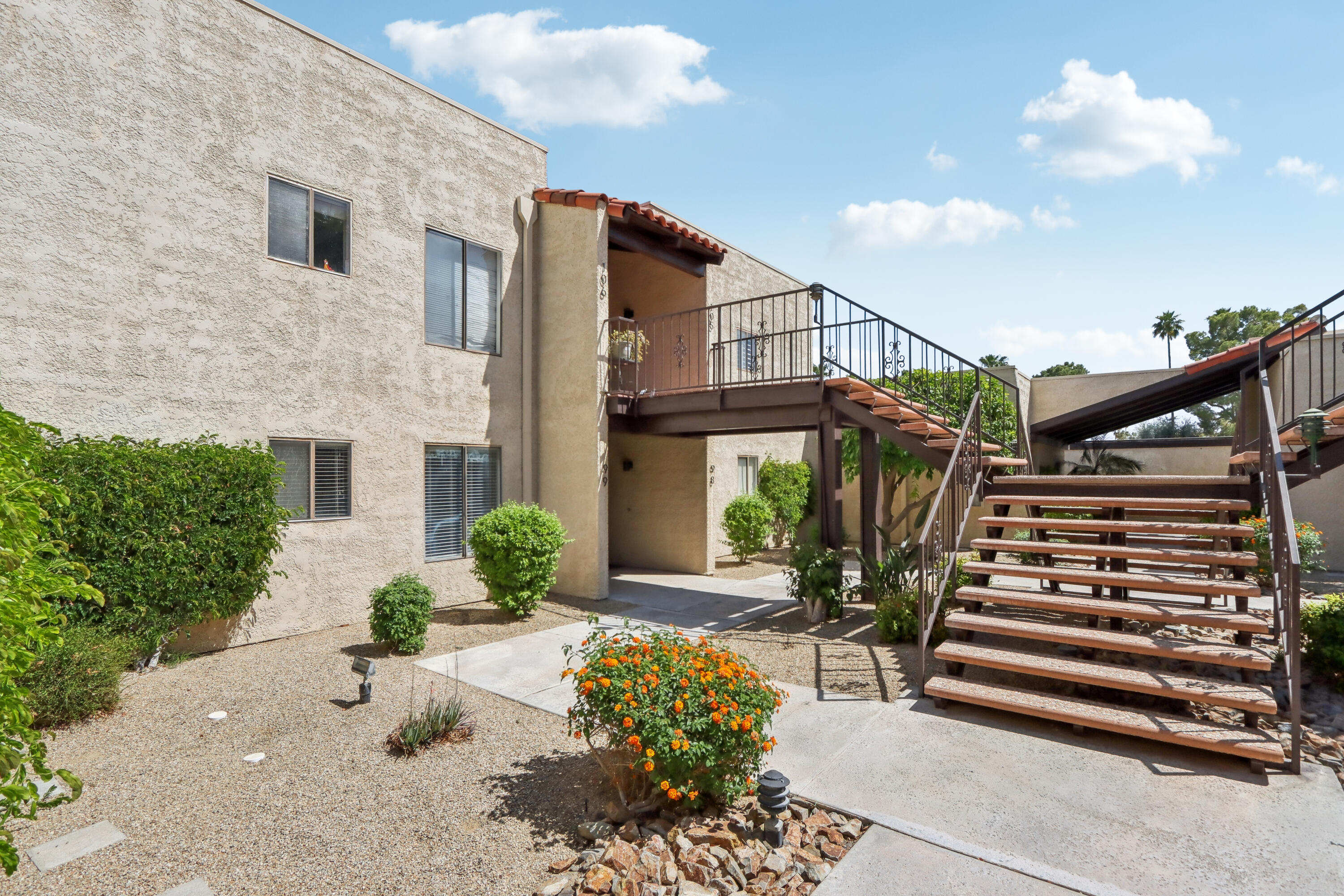 340 East San Jose Road, Unit 99 Palm Springs, CA 92264 - Photo 22 of 26 a front view of a house with a yard