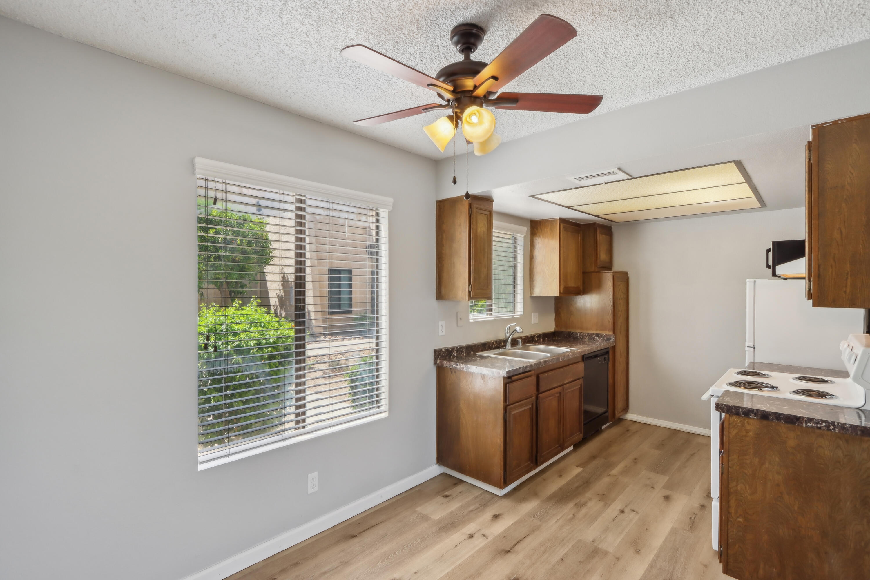 340 East San Jose Road, Unit 99 Palm Springs, CA 92264 - Photo 6 of 26 a kitchen with stainless steel appliances granite countertop a stove and a refrigerator