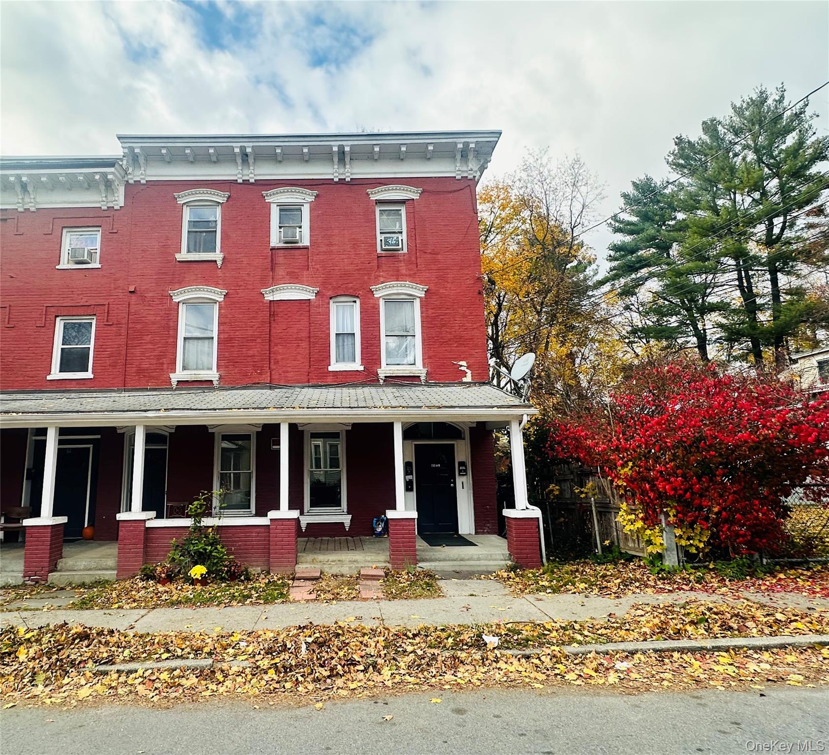 a view of a brick building with large windows