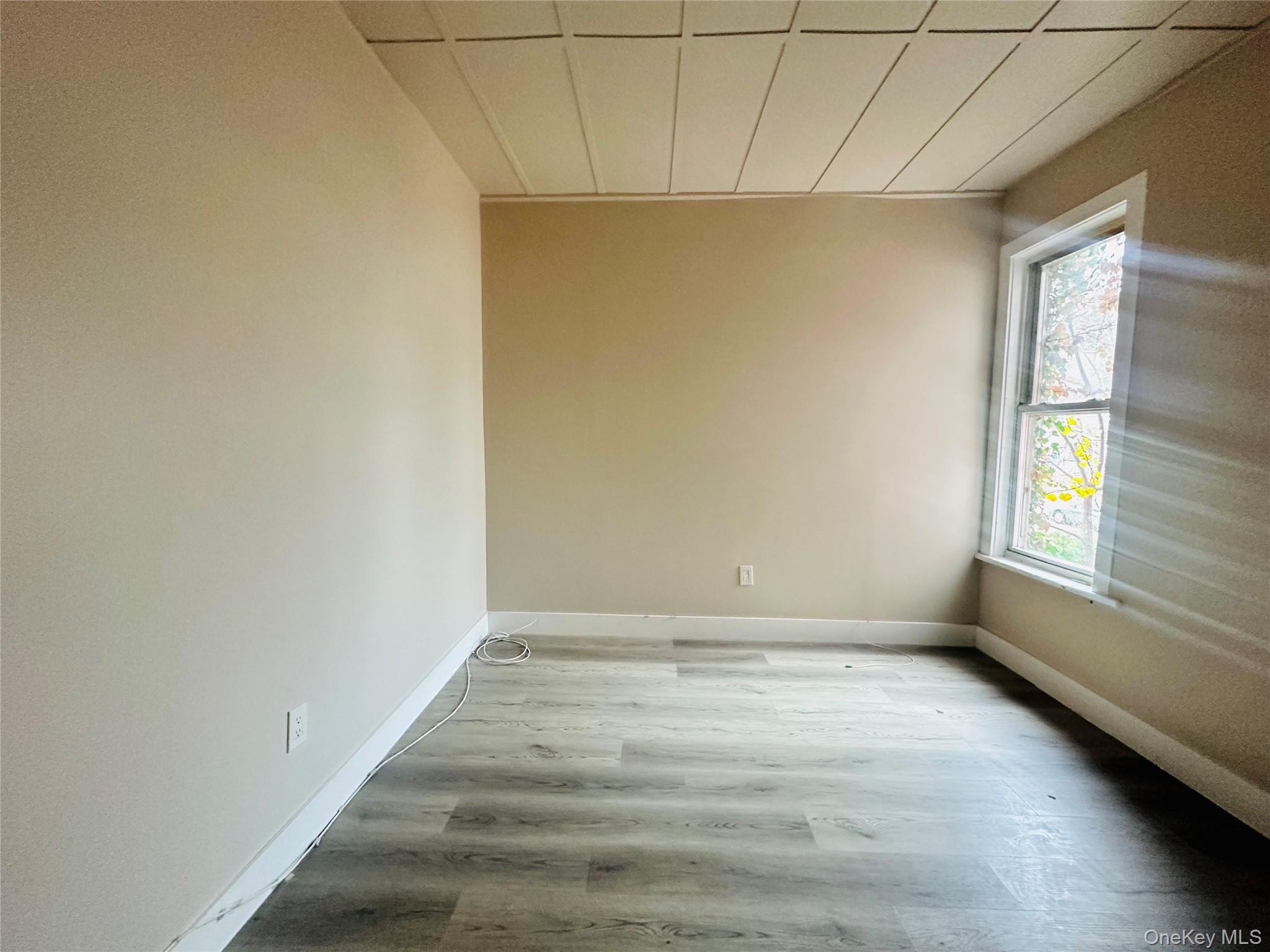 86.5 Garden Street, Unit 2 Poughkeepsie, NY 12601 - Photo 7 of 9 a view of an empty room with a window