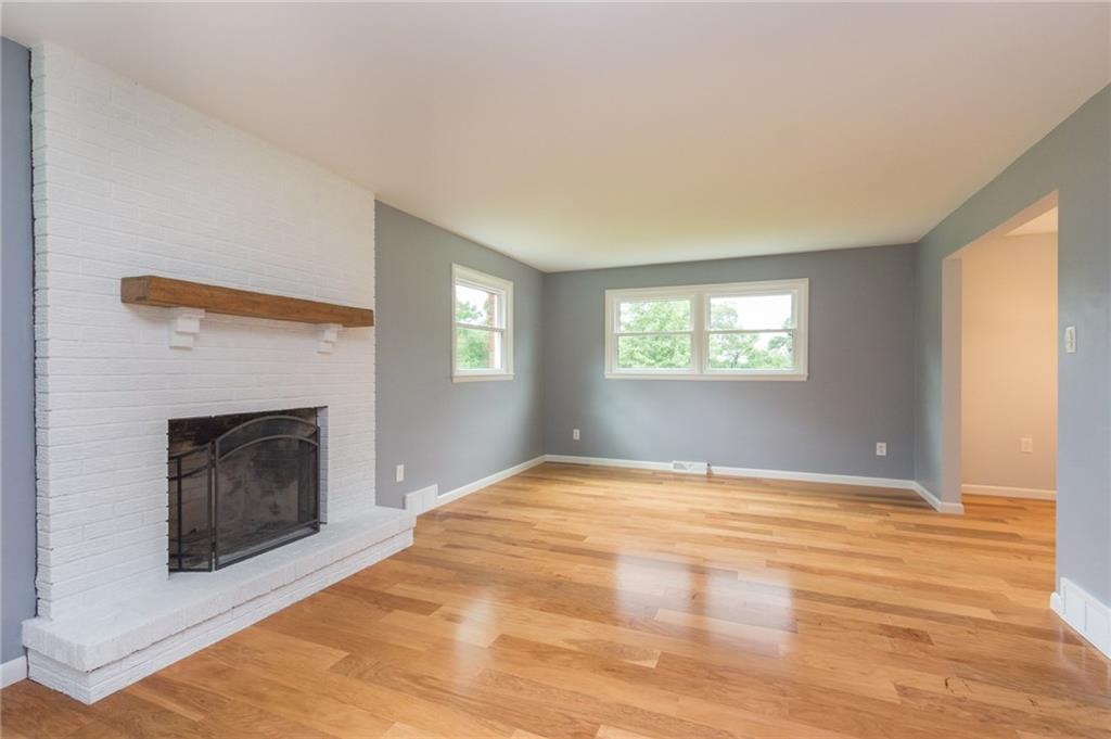 228 Howard Road Sewickley, PA 15143 - Photo 11 of 25 Wood burning fireplace with custom mantle.