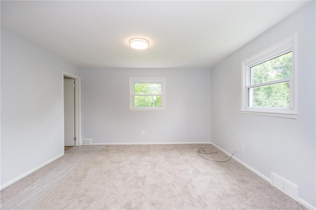 228 Howard Road Sewickley, PA 15143 - Photo 14 of 25 Spacious Master bedroom oasis with new carpet, new full on suite bath, and 5th bedroom converted to a walk in closet with dressing area.