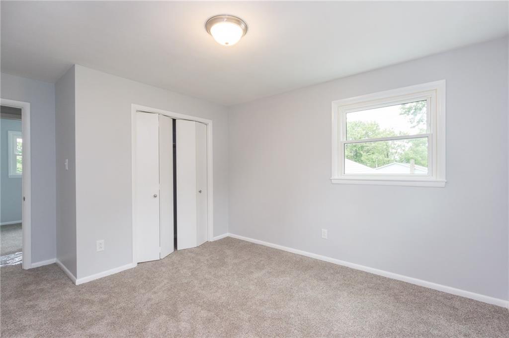 228 Howard Road Sewickley, PA 15143 - Photo 17 of 25 2nd bedroom has new carpet, freshly painted and new light fixtures.