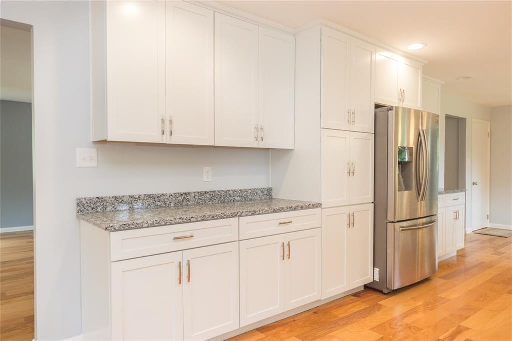 228 Howard Road Sewickley, PA 15143 - Photo 4 of 25 Another angle of the kitchen showing ample countertop space and built in pantry with additional cabinetry.