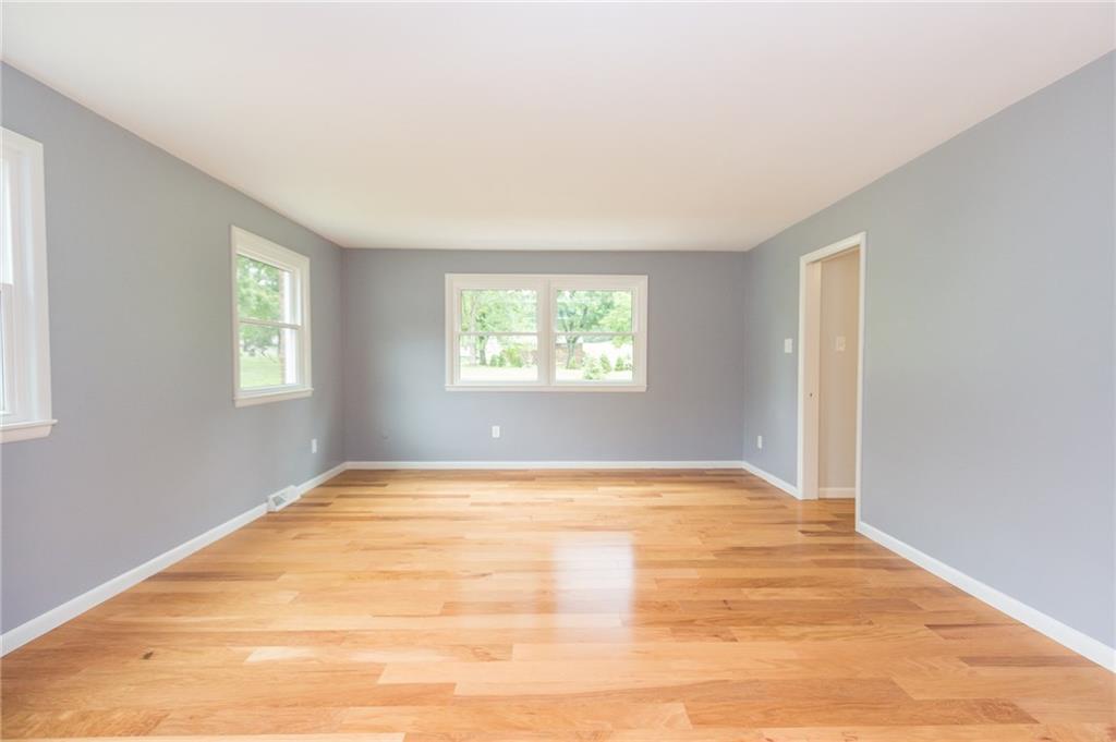 228 Howard Road Sewickley, PA 15143 - Photo 7 of 25 Spacious Formal Living room with neutral tones and hickory flooring.