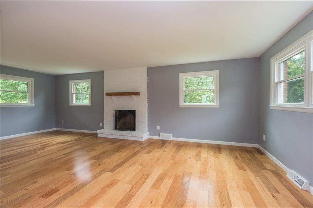 228 Howard Road Sewickley, PA 15143 - Photo 9 of 25 Family room will sure to be a favored gathering place with wood burning fireplace, custom mantle and lots of light.