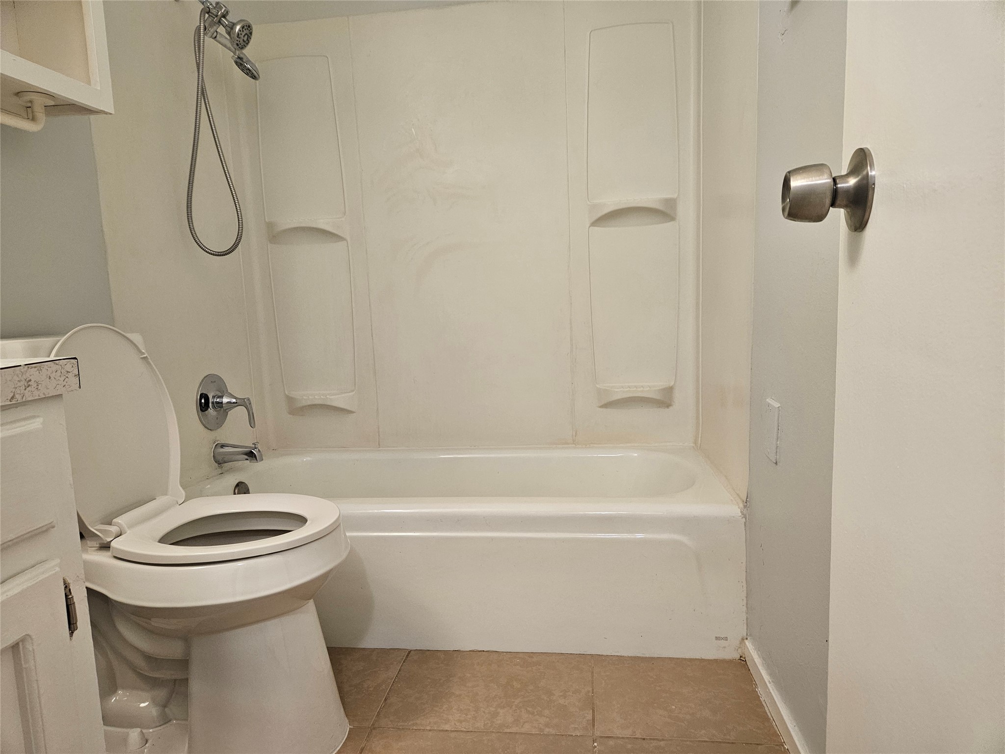 806 Ranch Road, Unit A Georgetown, TX 78628 - Photo 20 of 24 A well-maintained full bathroom featuring a tub and shower combination with hard-tile flooring.