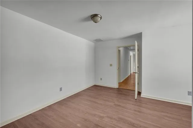 a view of a room with furniture and a window