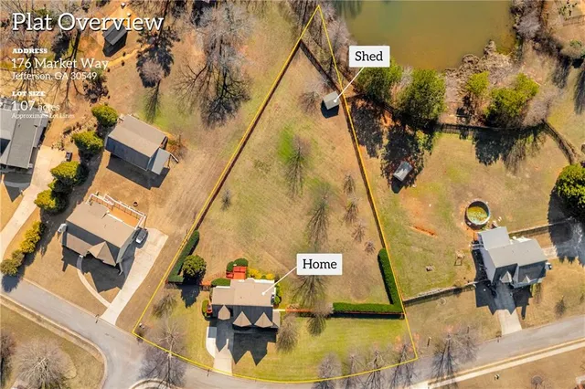 an aerial view of a house with a swimming pool