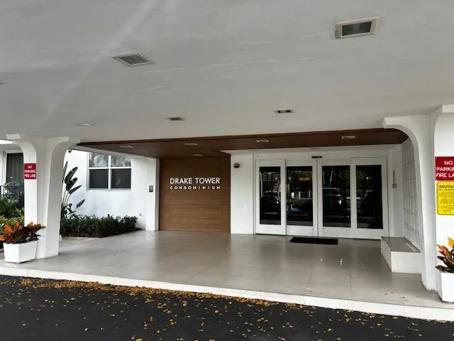 a front view of a house with a sitting area