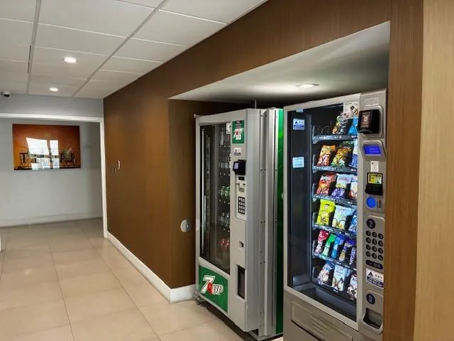 a lobby with a couch and a rug