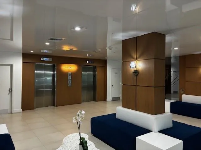 a city street lined with buildings and trees