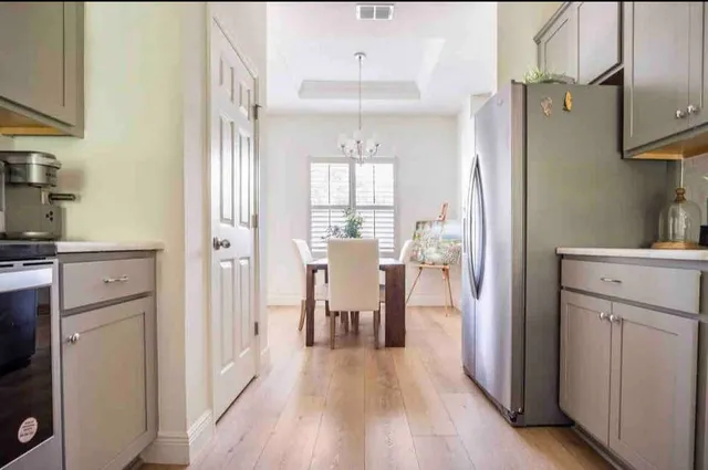 a view of a kitchen from the hallway