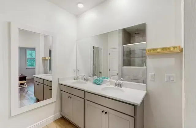 a bathroom with a sink and a mirror