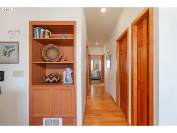 a view of an entryway with wooden floor