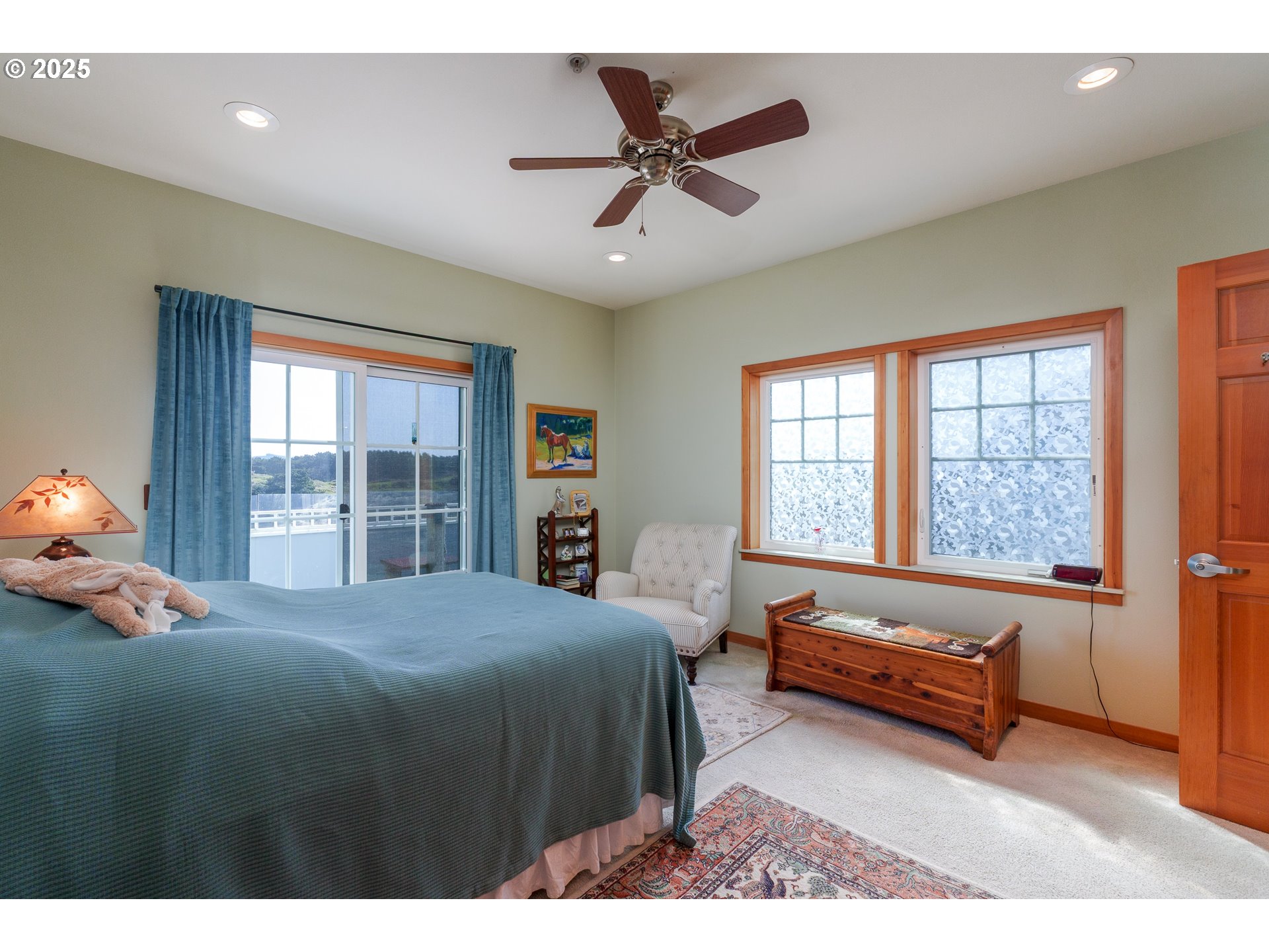 1327 Village Loop Bandon, OR 97411 - Photo 23 of 38 a bedroom with a bed and a window