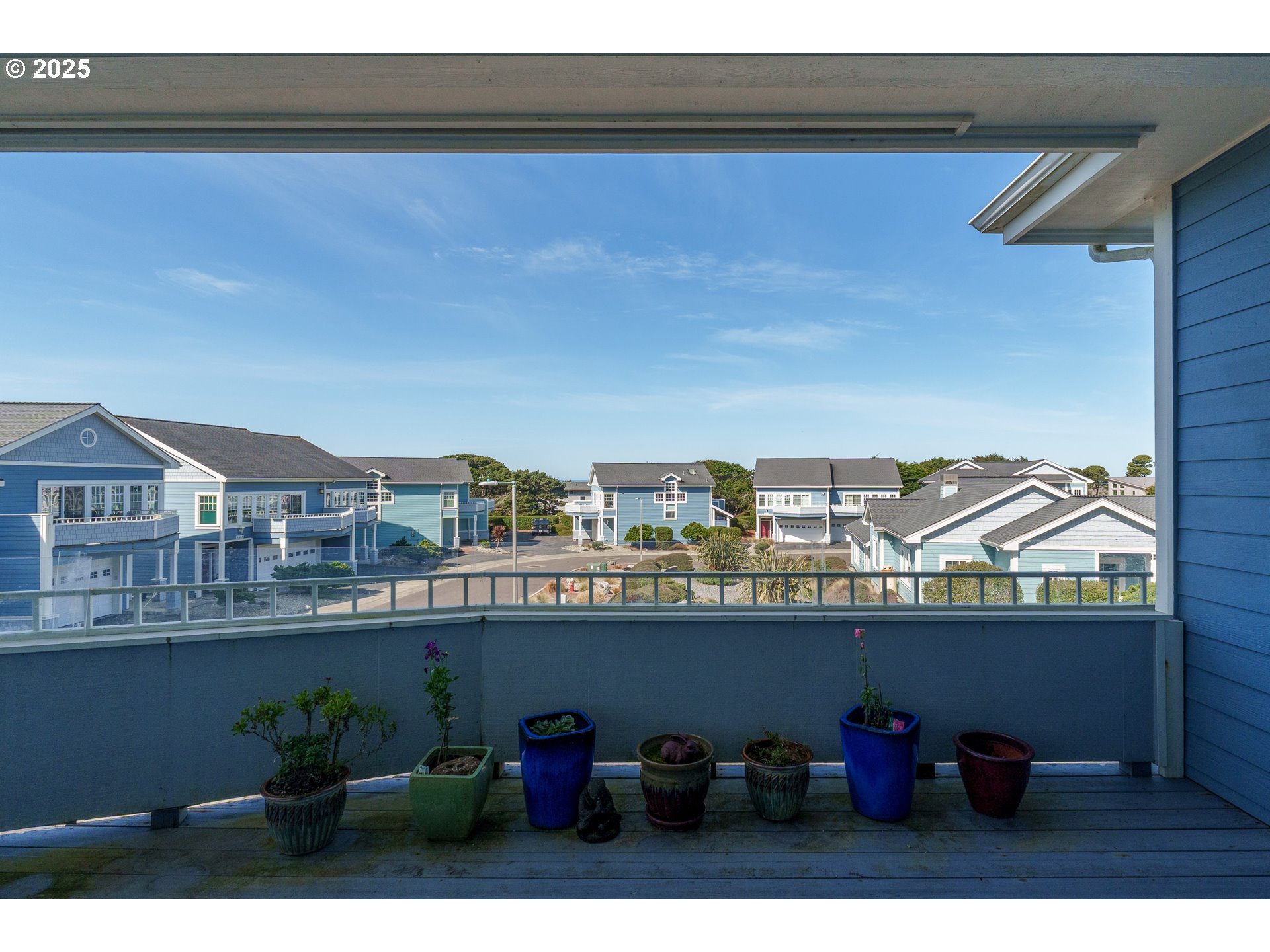 1327 Village Loop Bandon, OR 97411 - Photo 26 of 38 a terrace with a table and chairs
