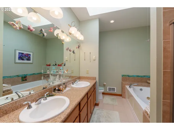 a bathroom with a sink a vanity and a mirror