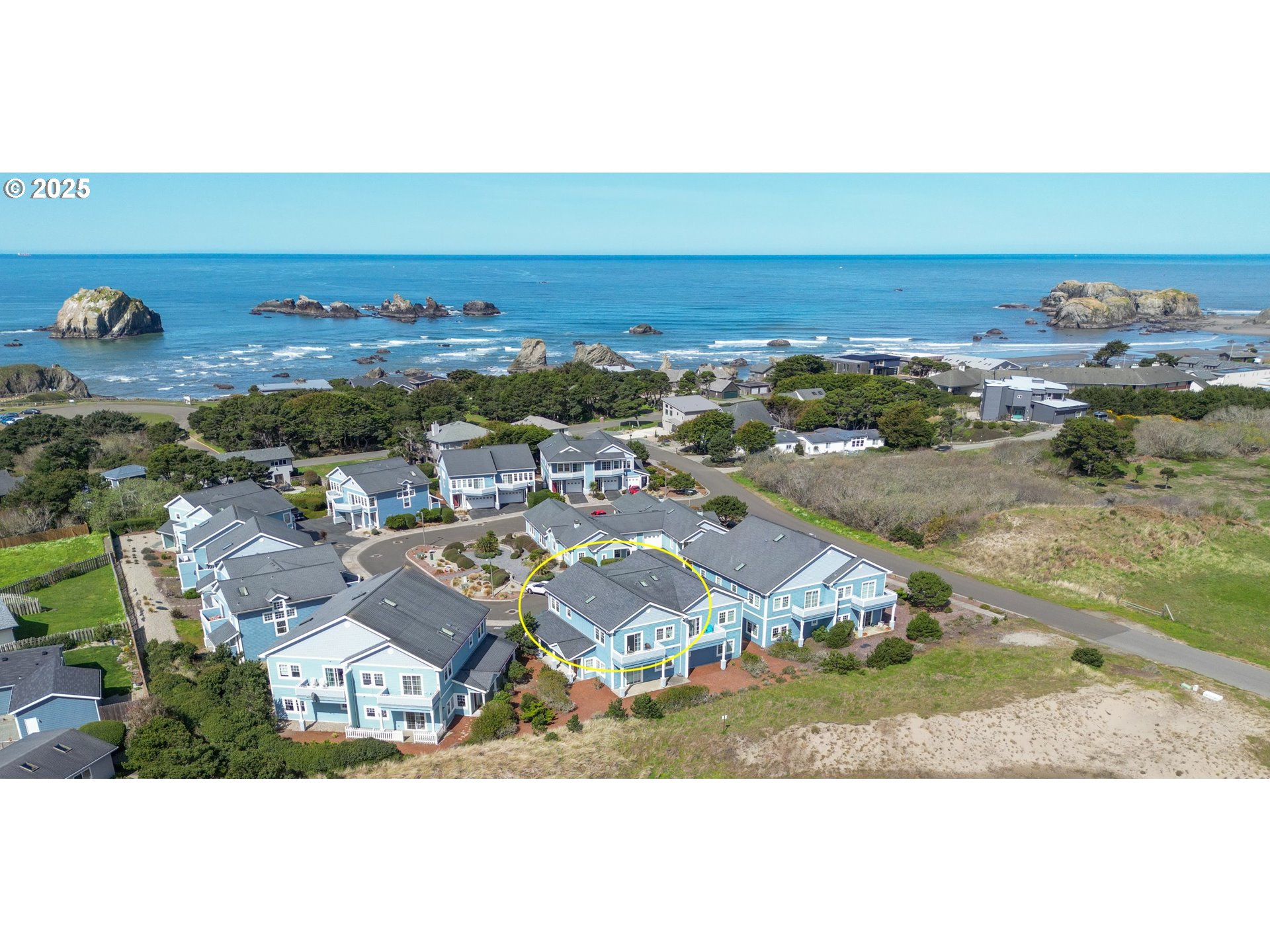 1327 Village Loop Bandon, OR 97411 - Photo 38 of 38 an aerial view of residential houses with outdoor space