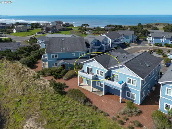 an aerial view of a house with a big yard