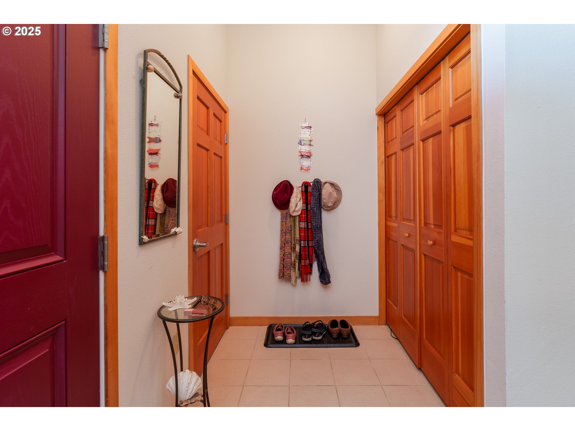 1327 Village Loop Bandon, OR 97411 - Photo 6 of 38 a view of an entryway with wooden floor