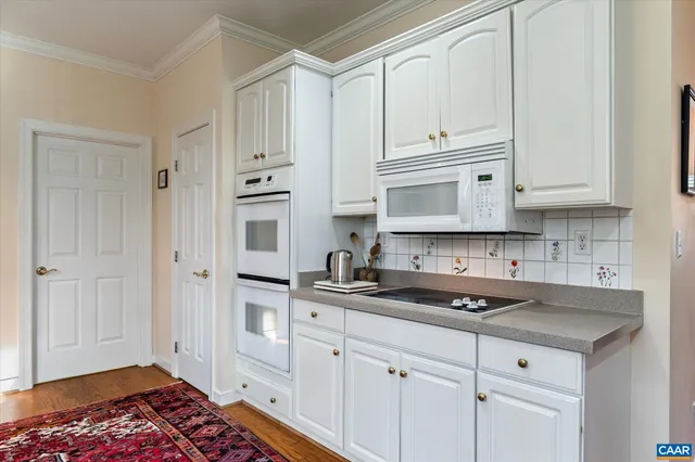 a kitchen with stainless steel appliances granite countertop a sink and cabinets